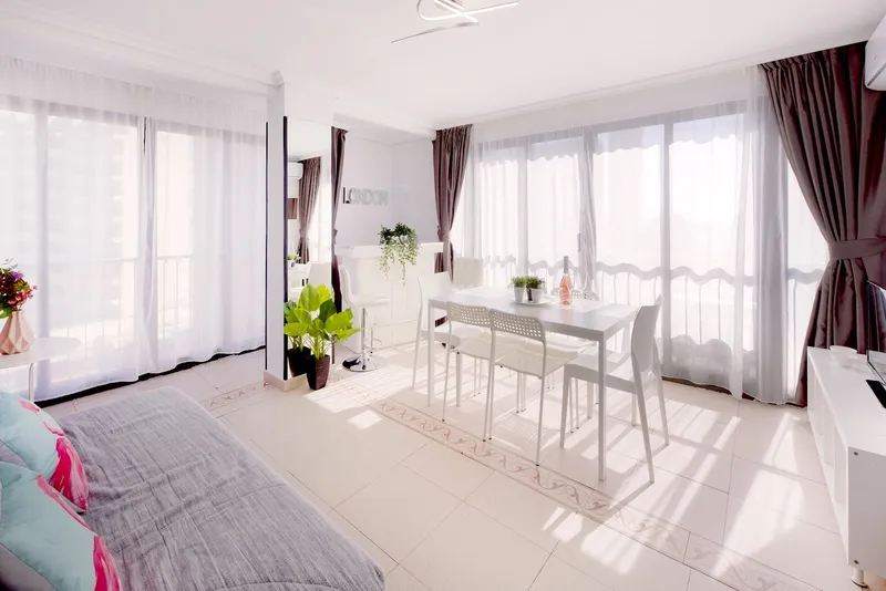 Pretty Payma: Living area, Dining table and sofa bed by large windows