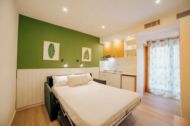 Palm Court: Studio, Sofa bed with kitchenette and balcony doors