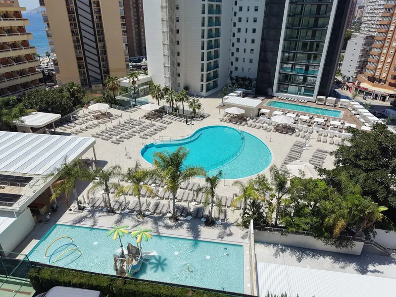 Port Benidorm: Pools from above, Pools, palms and loungers seen from a high floor