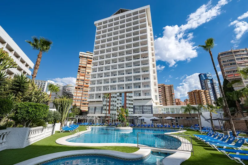 Poseidon Resort: The resort, Poseidon Resort tower above its pool and gardens