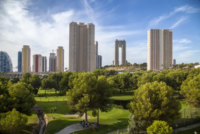 Benidorm Poniente: Park view, Green park with tall tower blocks behind