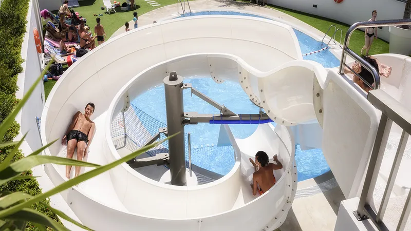 RH Princesa: Water slide, Children on a spiral slide into the pool