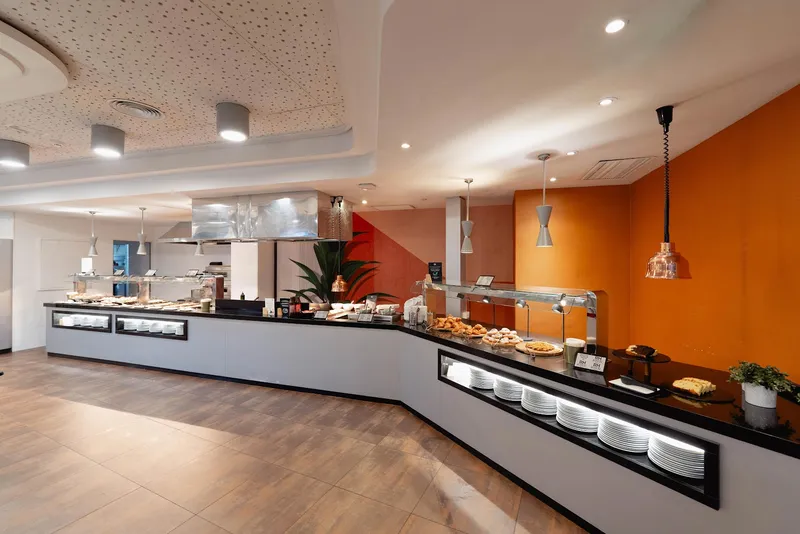 RH Royal: Buffet, Buffet counters with an orange feature wall