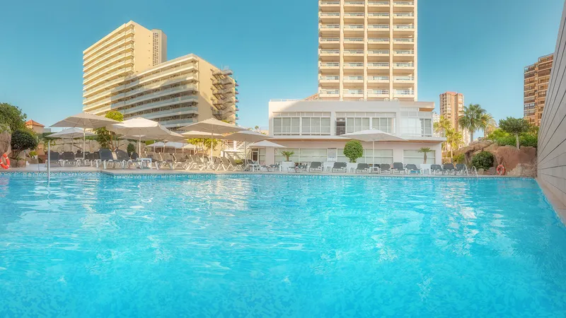 RH Victoria: Pool, Pool with parasols and loungers in front of the hotel towers