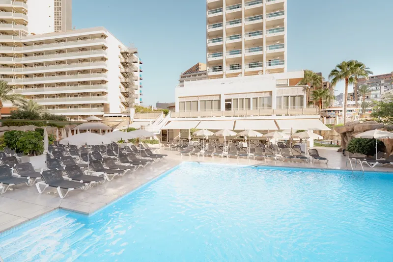 RH Victoria: Pool terrace, Pool and rows of loungers below the hotel buildings