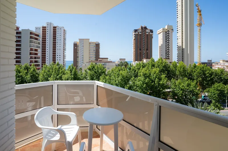 Riudor: Balcony, Balcony with table and chair over trees and towers