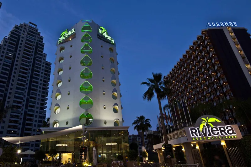 Riviera: The hotel at night, Hotel tower lit green at dusk with Riviera sign