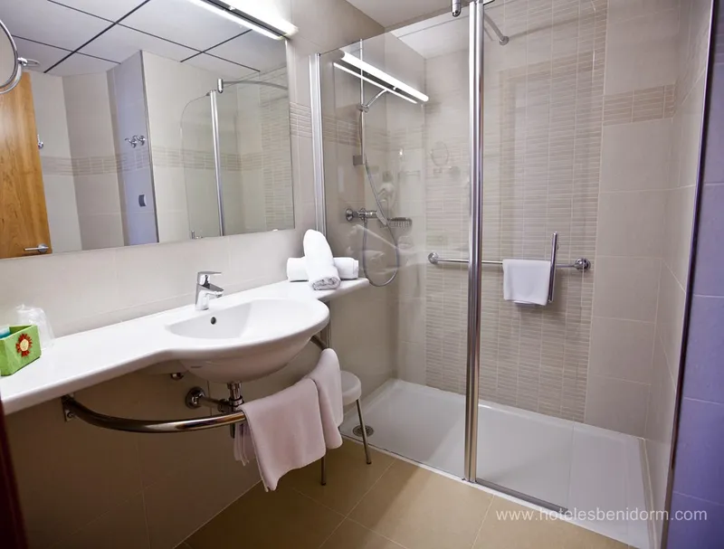 Riviera: Bathroom, Walk-in shower and curved basin with towel rail