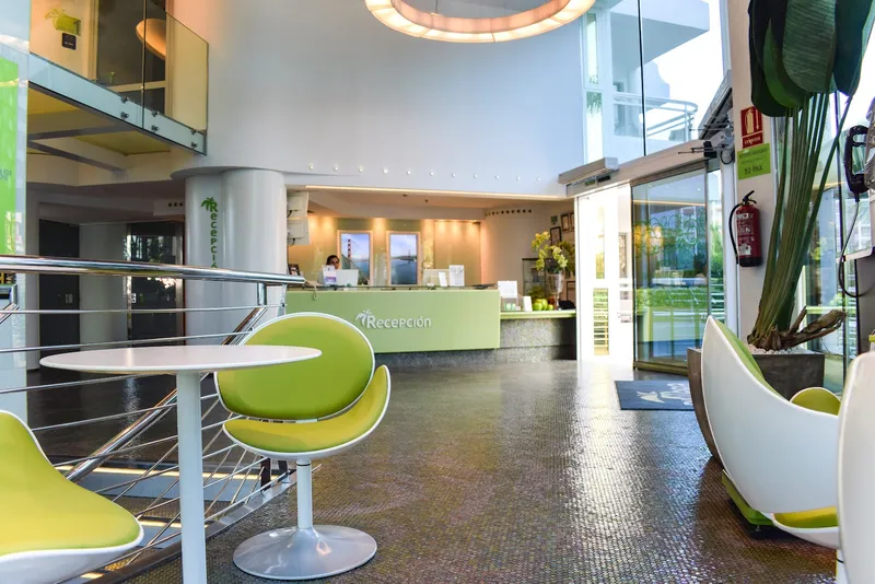 Riviera: Lobby, Lobby with green chairs and reception desk