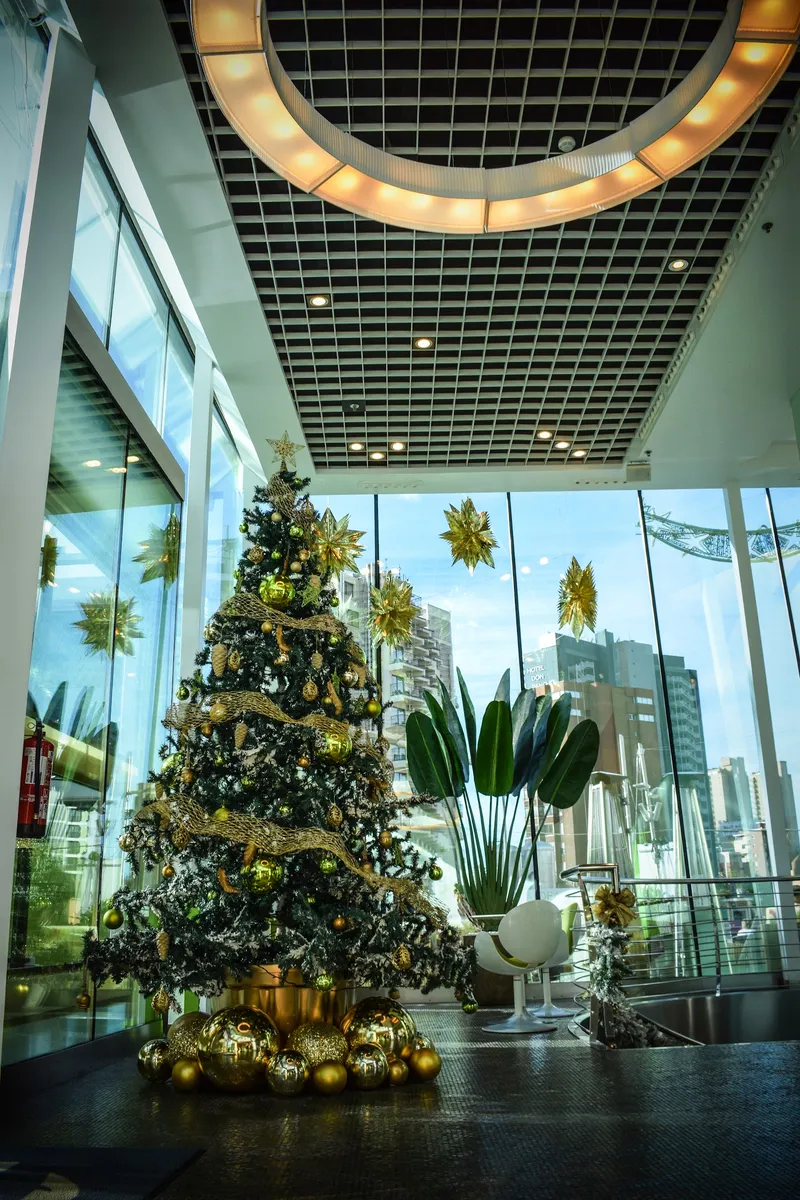 Riviera: Atrium, Glass atrium with a decorated Christmas tree