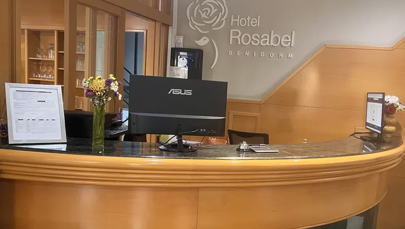 Rosabel: Reception, Curved reception desk below the Hotel Rosabel sign