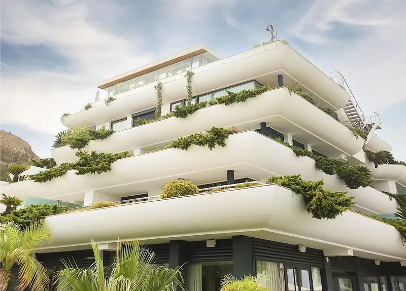 SHA: The building, Terraced white building with plants on each level