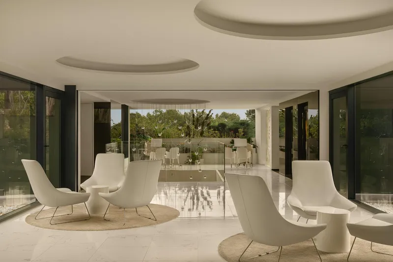 SHA: Lounge, White armchairs in a bright lounge with garden views