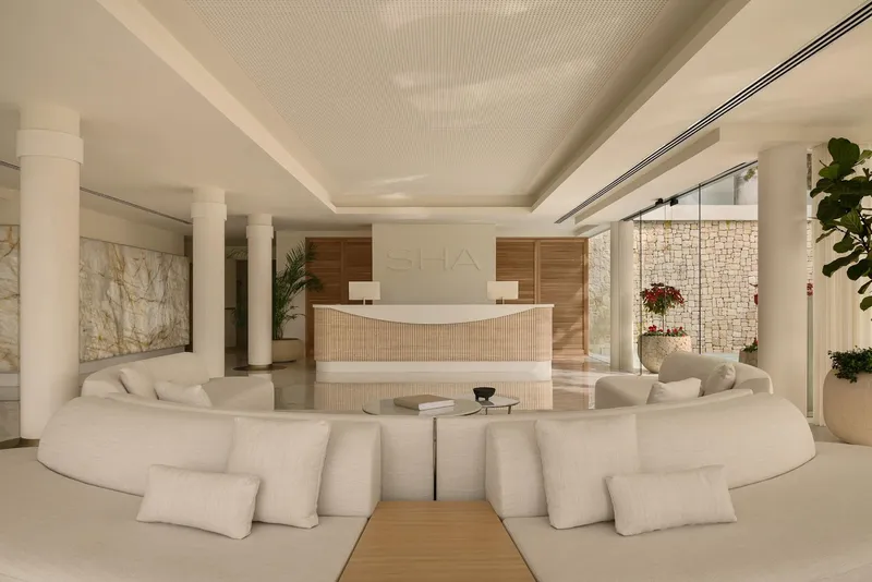 SHA: Lobby, Curved white sofas facing the SHA reception desk