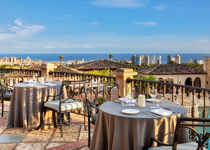The Level: Terrace dining, Laid tables on a terrace with views to the sea