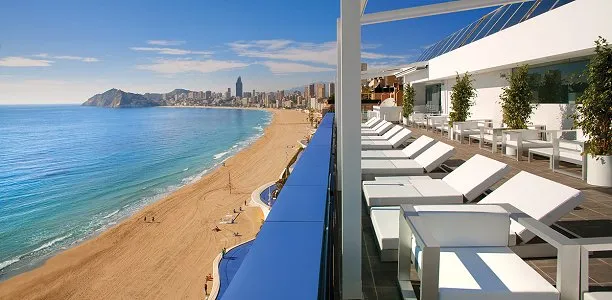 Villa del Mar: Sun terrace, Terrace loungers above a long sandy beach