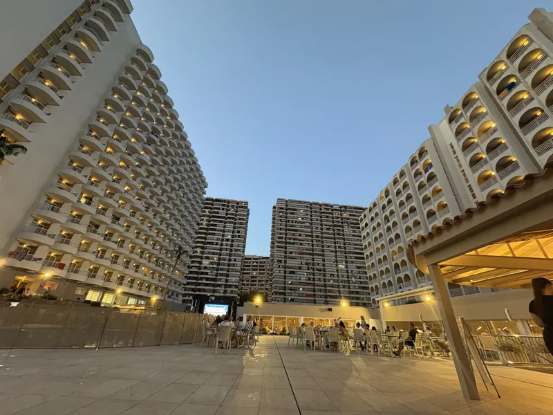 Pelícanos and Ocas: The twin blocks at dusk, the terrace lit up