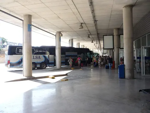 The coach bays inside the bus station.